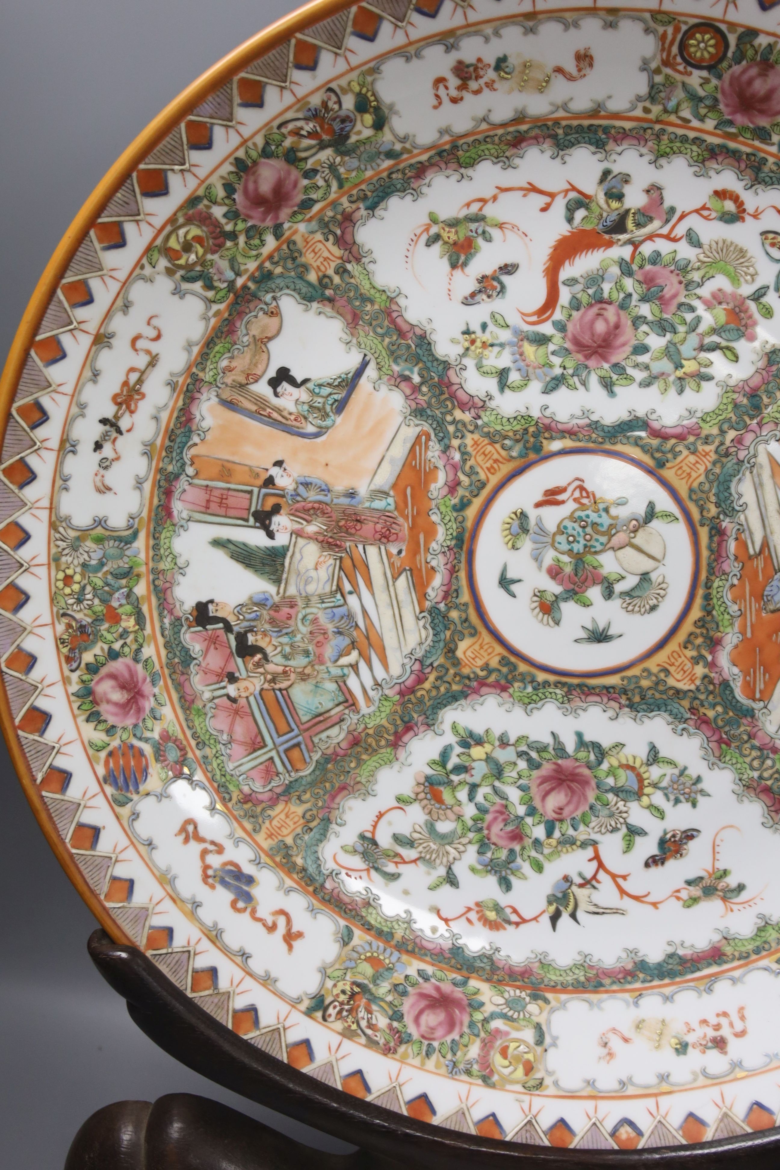 A large 20th century Chinese famille rose porcelain charger, diameter 46cm, on hardwood stand